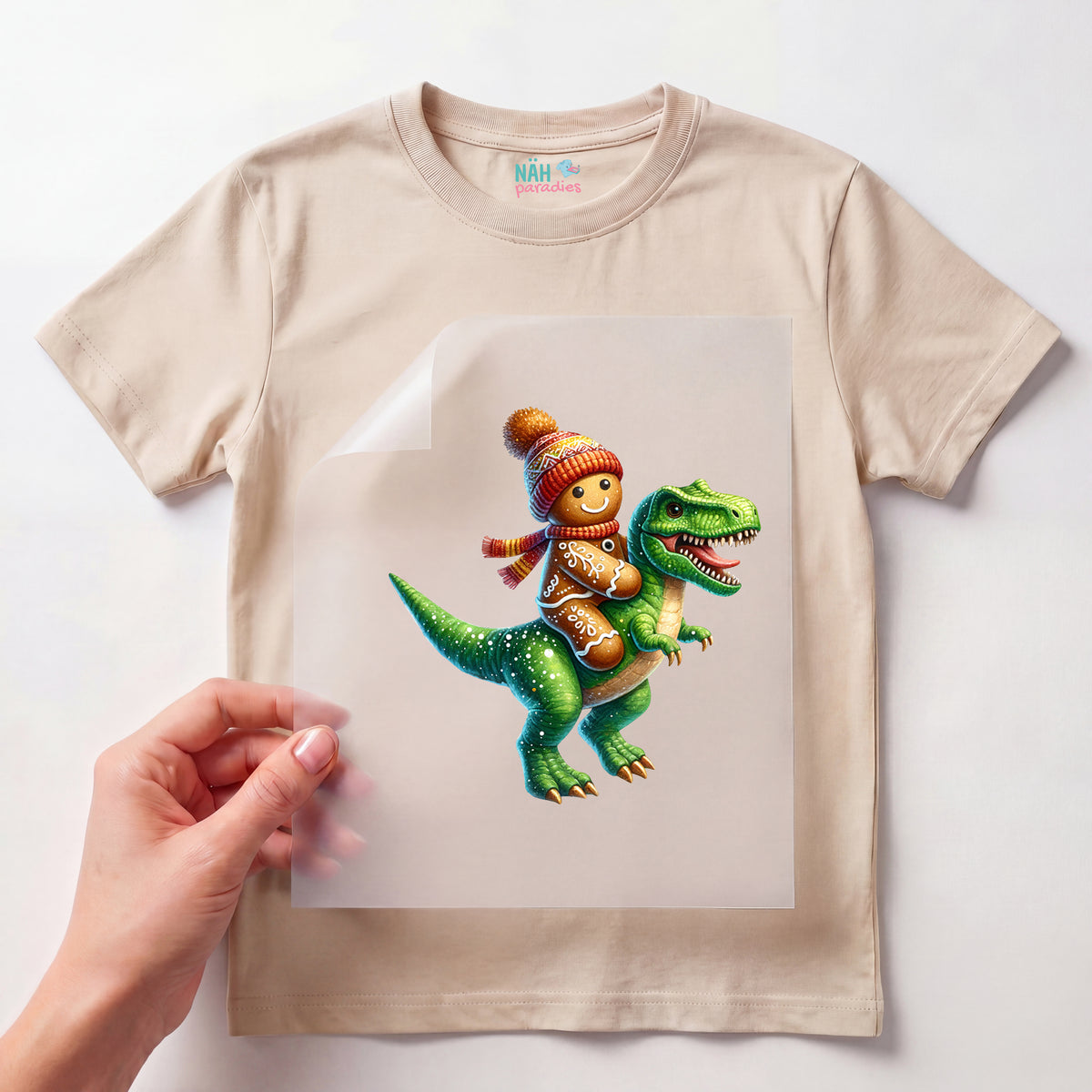 Bügelbild Lebkuchenritt auf Dinosaurier